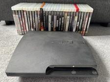 Sony PlayStation 3 Slim Console, 29 games, and camera. No controller or cords.
