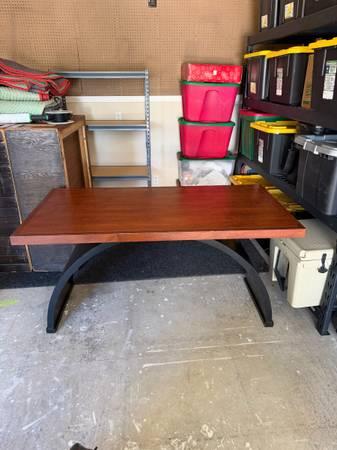 Large black base and brown top table.