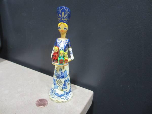 Hand Carved, painted and Signed Russian Girl Holding Nesting Dolls