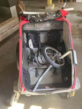 Double kid stroller with bike and jogger attachments