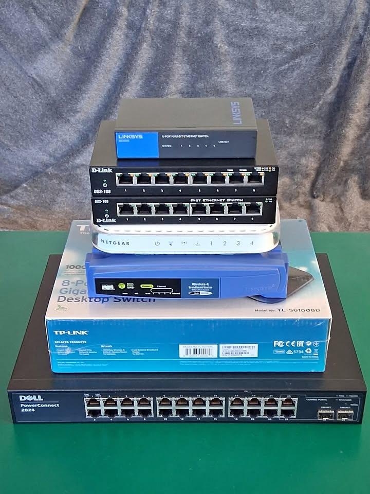 Network equipment, seven items total - two wifi routers, five switches