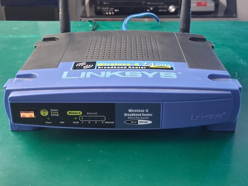 Network equipment, seven items total - two wifi routers, five switches 7