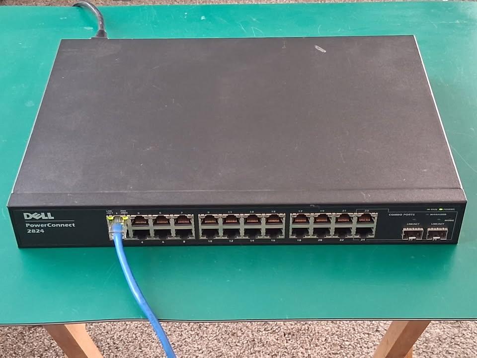 Network equipment, seven items total - two wifi routers, five switches 8