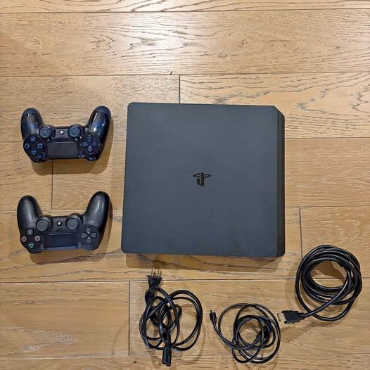 PS4 with 2 controllers and chords