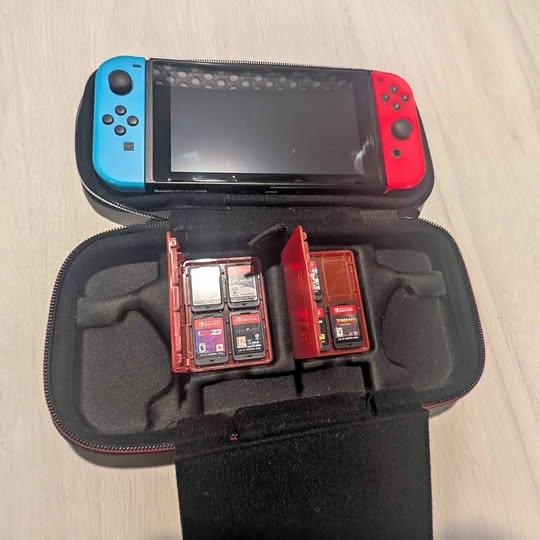 Nintendo Switch with Mario Case and 7 games