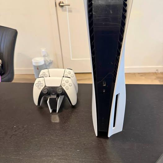 Sony PS5 console with two controllers and charging station