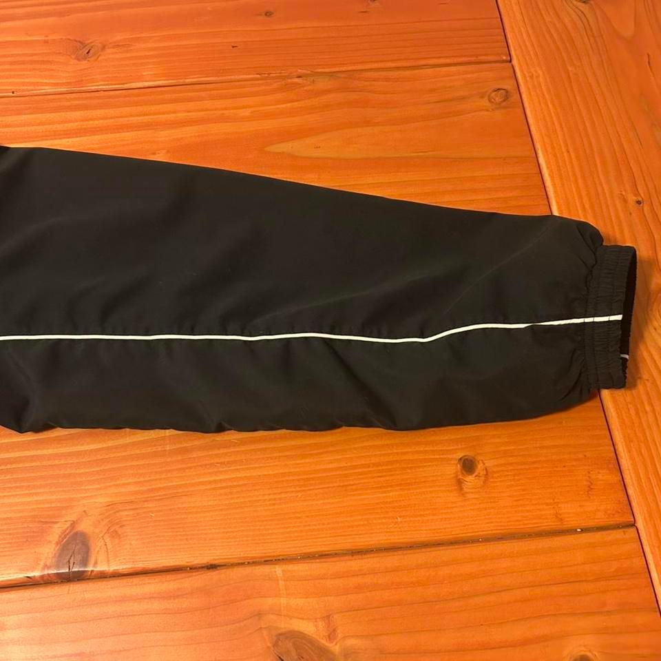 Black Nordic Track Windbreaker With 2