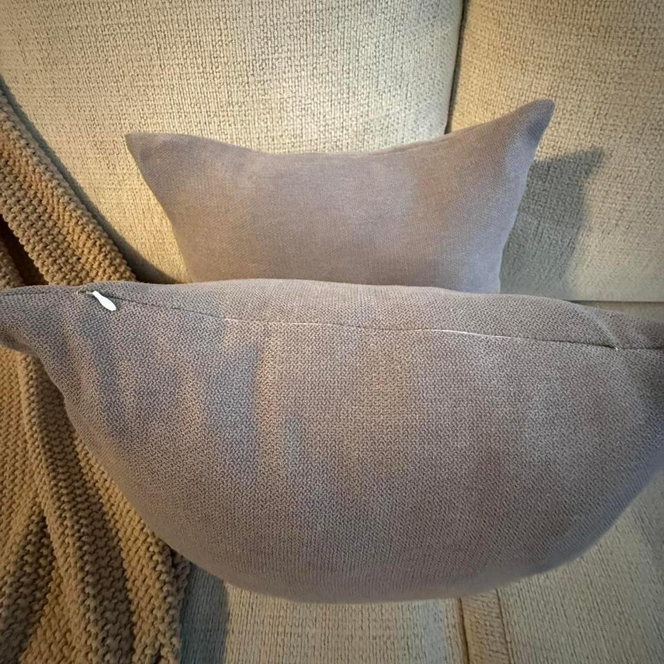 Two Gray Throw Pillows In 4