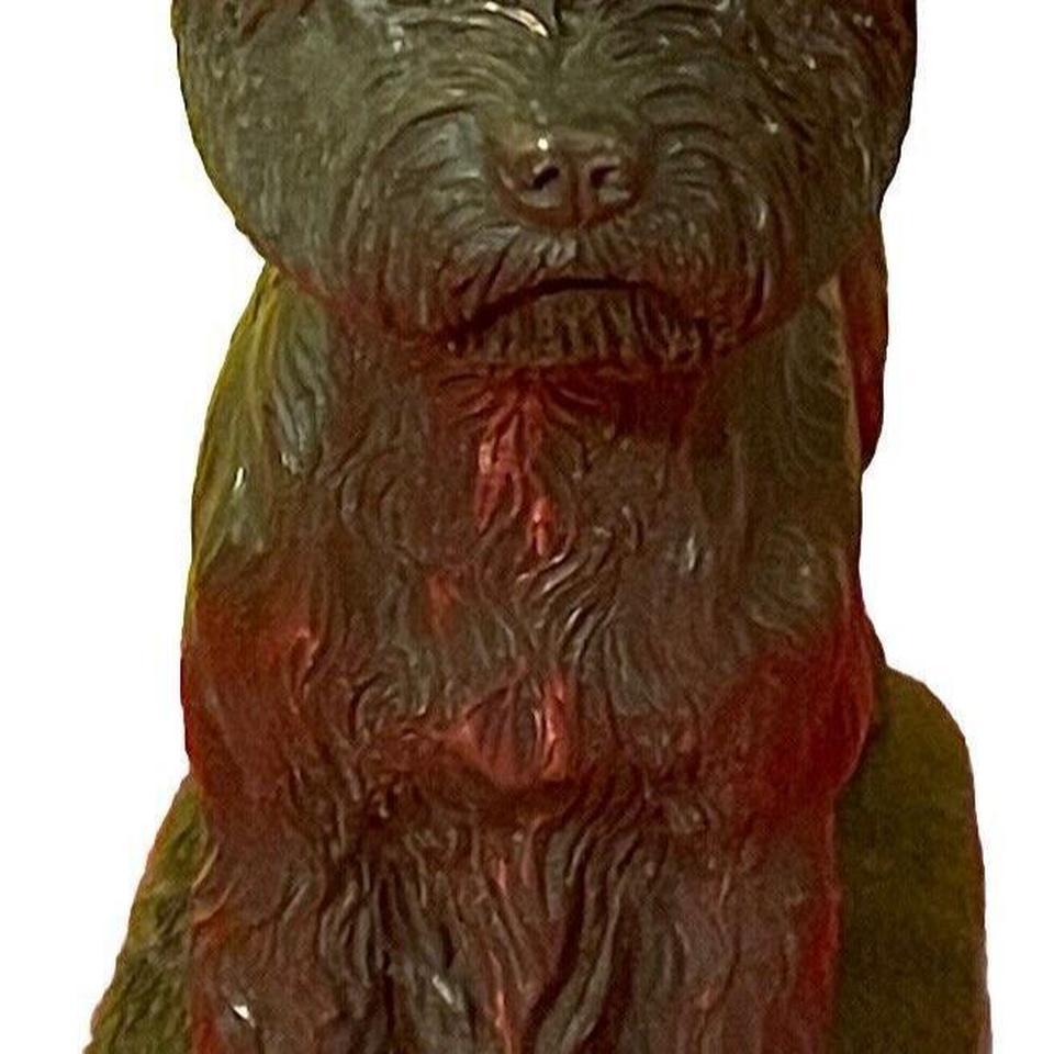This Antique Sculpture Features A