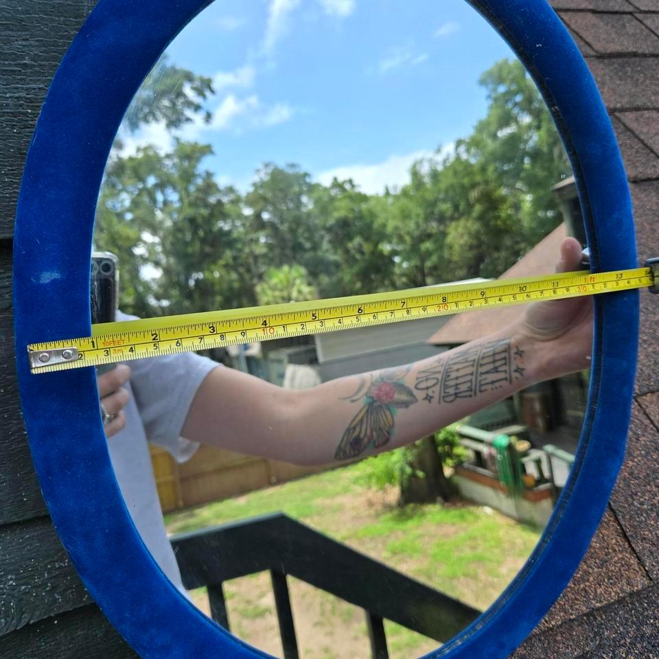 Blue Oval Mirror With A 6