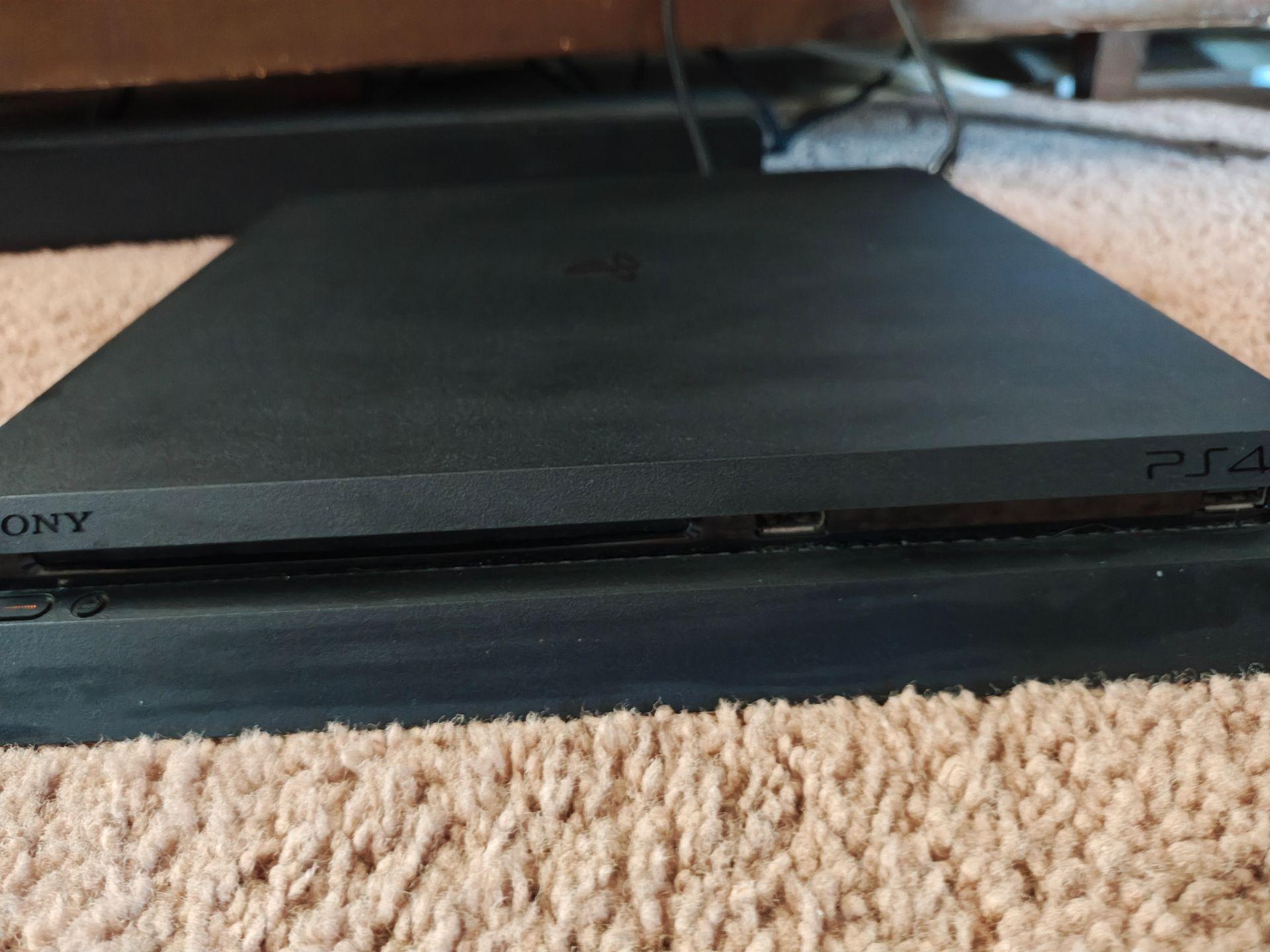PlayStation 4 1TB Slim with 2 controllers and 7 games - PS4